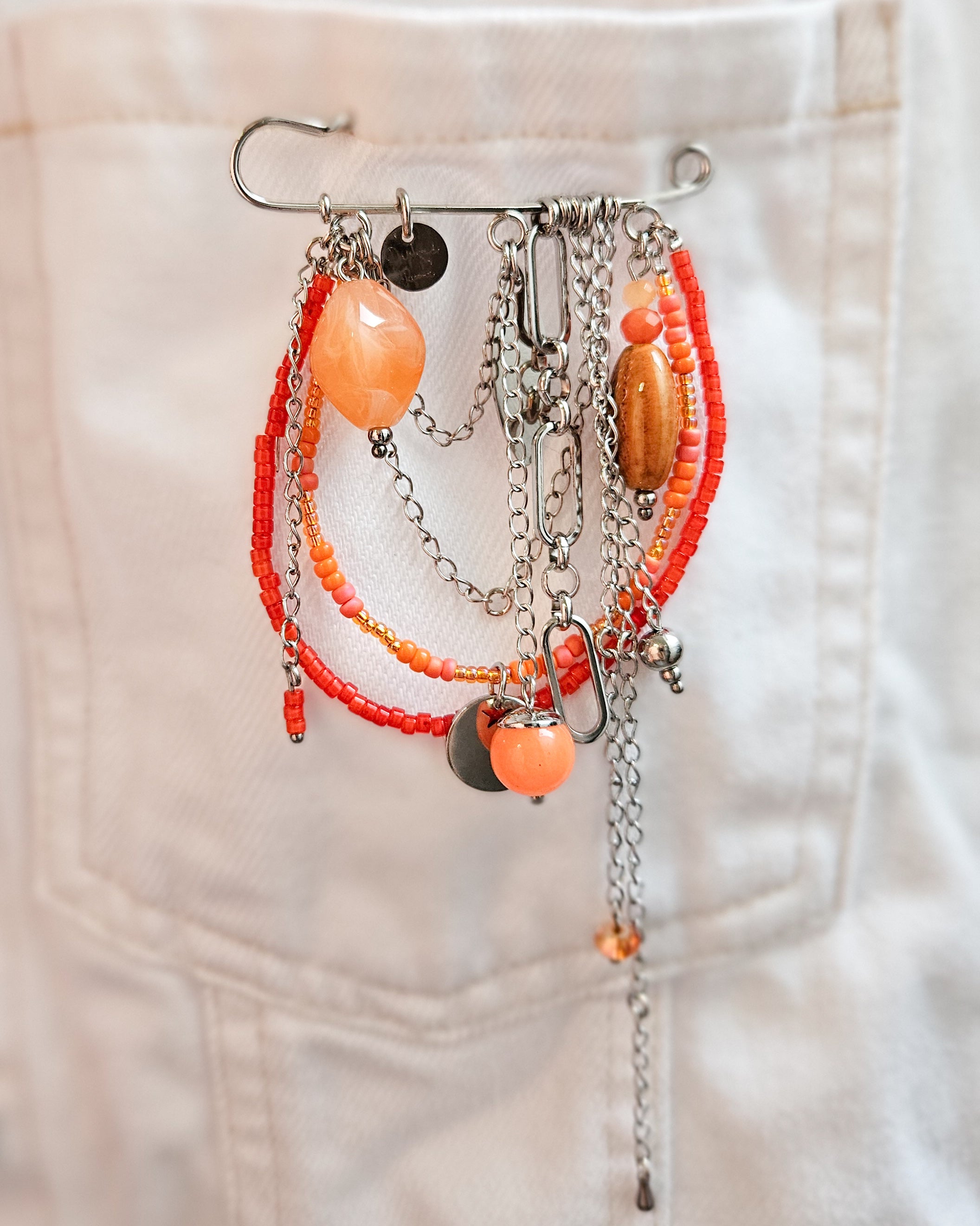 Broche chaînette orange